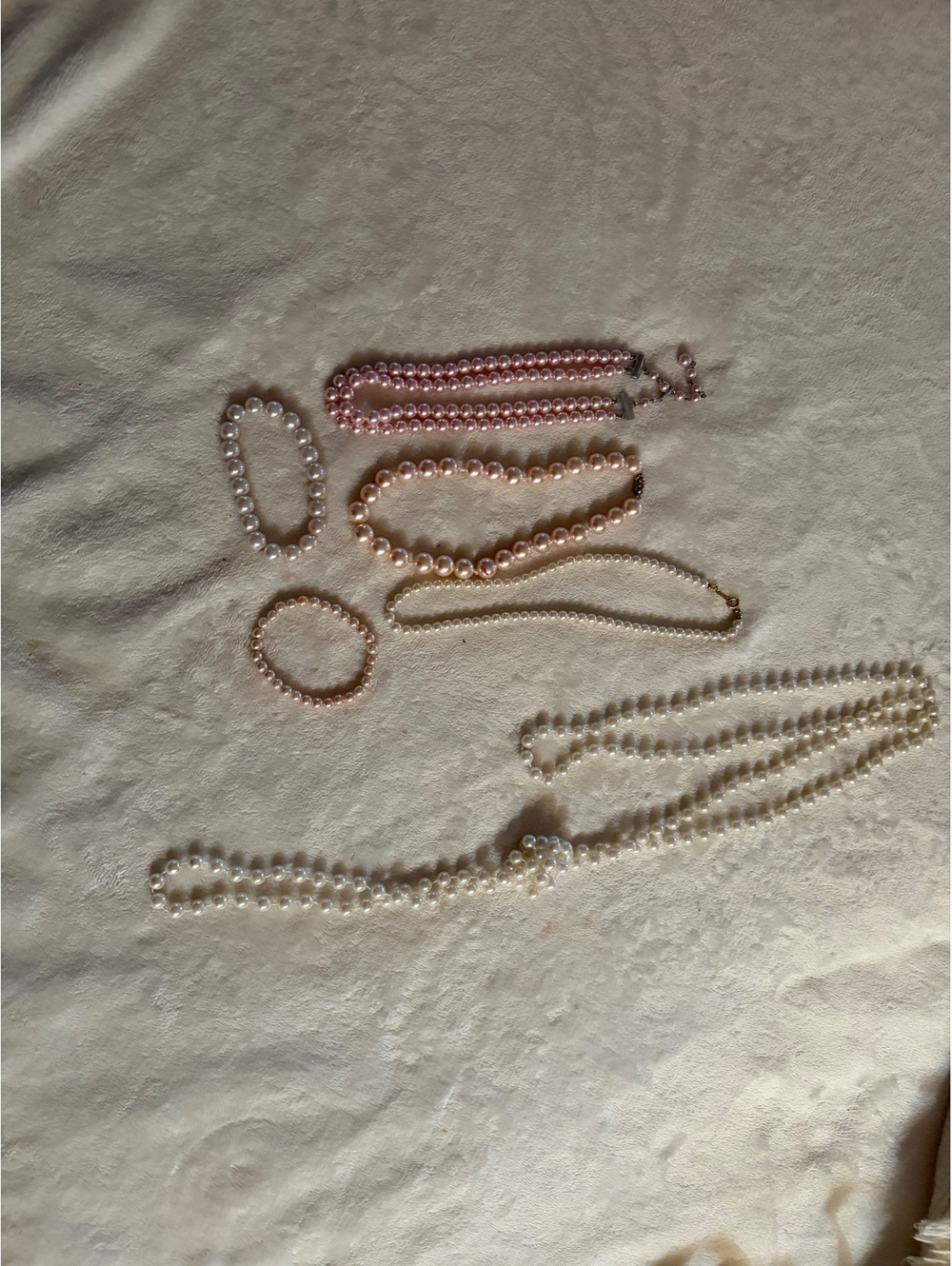 set of faux pearl necklaces and bracelets pink tone